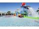 Water park area with vibrant slides and a tipping bucket, offering endless water fun for all ages at 2428 Dubai St, Kissimmee, FL 34747