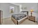 Cozy bedroom featuring a full-size bed and a window at 7001 Oakwood St, Davenport, FL 33837