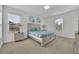 Serene bedroom with a plush bed and neutral tones, offering a peaceful atmosphere at 7001 Oakwood St, Davenport, FL 33837