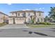 Two-story house with three-car garage, and manicured landscaping at 7001 Oakwood St, Davenport, FL 33837