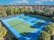 Tennis and pickleball courts with blue and green surfaces at 7001 Oakwood St, Davenport, FL 33837