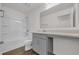 Bathroom featuring a tub/shower combo, gray vanity, and large mirror at 8560 Caribbean Pine Way, Lakeland, FL 33809