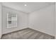 Cozy bedroom with a window letting in natural light and plush carpeting at 8560 Caribbean Pine Way, Lakeland, FL 33809