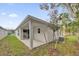 Back porch with view of small yard at 8645 Caribbean Pine Way, Lakeland, FL 33809