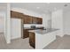 Stylish kitchen with dark wood cabinets, granite counters, and stainless steel appliances at 8645 Caribbean Pine Way, Lakeland, FL 33809