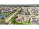 Community aerial view showcasing homes with screened-in pools and lush landscaping at 5200 Landmark Dr, St Cloud, FL 34771
