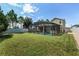 Spacious backyard with screened-in pool and view of the home at 5200 Landmark Dr, St Cloud, FL 34771