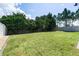 Large backyard with lush green grass and privacy fence at 5200 Landmark Dr, St Cloud, FL 34771