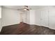 The bright bedroom boasts dark hardwood floors and access to additional rooms at 5200 Landmark Dr, St Cloud, FL 34771