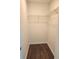 Walk-in closet with wire shelving and dark laminate flooring at 5200 Landmark Dr, Saint Cloud, FL 34771