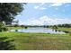 Scenic community lake with fountain and green space at 5200 Landmark Dr, St Cloud, FL 34771