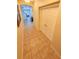 Hallway featuring tile flooring, closet, and arched doorways in neutral tones at 5200 Landmark Dr, St Cloud, FL 34771