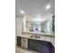Open kitchen featuring granite countertops, stainless steel appliances, and views of the living room at 5200 Landmark Dr, St Cloud, FL 34771