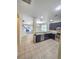 Open floor plan showcasing the kitchen with granite countertops and stainless steel appliances at 5200 Landmark Dr, St Cloud, FL 34771