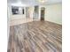 Spacious living room showcasing hardwood flooring and an open layout at 5200 Landmark Dr, St Cloud, FL 34771