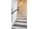 Modern staircase featuring dark wood and white balusters at 5200 Landmark Dr, Saint Cloud, FL 34771