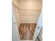 Spacious walk-in closet with built-in shelving and hardwood floors at 5200 Landmark Dr, St Cloud, FL 34771