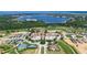 Expansive aerial view showcasing the lakefront community, golf course, and upscale residences at 16828 Vinci Way, Montverde, FL 34756