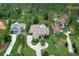 Beautiful aerial view of home with manicured lawn, a stone driveway and backyard pool at 16828 Vinci Way, Montverde, FL 34756