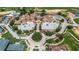 Stunning aerial view of resort-style community with a pool, golf course, and luxurious amenities at 16828 Vinci Way, Montverde, FL 34756