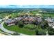 Aerial view showcasing the community, golf course, lush trees and landscaping at 16828 Vinci Way, Montverde, FL 34756