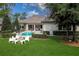 Outdoor living space featuring a pool, patio, and manicured landscaping at 16828 Vinci Way, Montverde, FL 34756