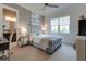 Bright bedroom with a comfortable bed and en-suite bathroom at 16828 Vinci Way, Montverde, FL 34756