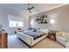 Bedroom with a large window, neutral walls, and stylish decor creates a serene and inviting atmosphere at 16828 Vinci Way, Montverde, FL 34756
