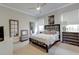 Bedroom featuring neutral tones, soft lighting, and stylish furnishings create a peaceful and inviting space at 16828 Vinci Way, Montverde, FL 34756