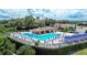 An inviting community pool with lounge chairs, covered cabanas and lush landscaping at 16828 Vinci Way, Montverde, FL 34756