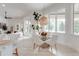 Bright dining area featuring a modern light fixture and large windows with a view at 16828 Vinci Way, Montverde, FL 34756