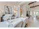 Elegant dining room with a large table, stylish chairs, a modern chandelier, and bright natural light at 16828 Vinci Way, Montverde, FL 34756