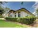 Exterior of the home with large windows and lush landscaping at 16828 Vinci Way, Montverde, FL 34756