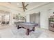 Game room features a pool table, bar area, and comfortable seating at 16828 Vinci Way, Montverde, FL 34756