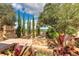 Picturesque garden view featuring lush greenery, stone pathways, and scenic water views at 16828 Vinci Way, Montverde, FL 34756