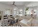 Bright living room boasts modern furniture, stylish rug, and sliding glass doors to the outdoor space at 16828 Vinci Way, Montverde, FL 34756