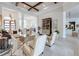 Expansive living room with beamed ceilings, tile floors, and elegant furnishings with an open design at 16828 Vinci Way, Montverde, FL 34756