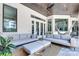 Outdoor patio with comfortable seating, high ceilings, a hammock, and views of the yard at 16828 Vinci Way, Montverde, FL 34756
