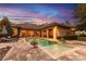 Stunning backyard pool with a lounge area perfect for relaxing at dusk at 16828 Vinci Way, Montverde, FL 34756