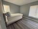 Small bedroom with gray walls and wood-look floors at 17 S Flag Ct, Kissimmee, FL 34759