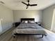 Spacious bedroom with gray walls and wood-look floors at 17 S Flag Ct, Kissimmee, FL 34759