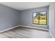 Bright bedroom with large window and light grey walls at 17 S Flag Ct, Kissimmee, FL 34759