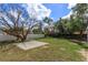 View of a backyard with a large shade tree and fenced perimeter at 220 Lake Gene Dr, Longwood, FL 32779