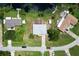 Aerial view of a home with a fenced pool and a large backyard near the water at 1053 Abadan Dr, Deltona, FL 32725