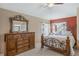 Relaxing bedroom with a metal bed frame and dresser at 1053 Abadan Dr, Deltona, FL 32725