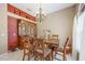 Bright dining room with a wooden table set and hutch at 1053 Abadan Dr, Deltona, FL 32725