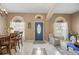 Inviting entryway with a blue door and tiled floor at 1053 Abadan Dr, Deltona, FL 32725