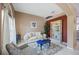 Cozy living room with a beige sofa and blue accent table at 1053 Abadan Dr, Deltona, FL 32725