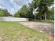 Backyard with a large cleared area and a wooden fence at 6 N Hudson St, Orlando, FL 32835