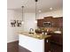 Beautiful kitchen with granite countertops, stainless steel appliances, large island, and wood cabinets at 2652 Carrickton Cir, Orlando, FL 32824